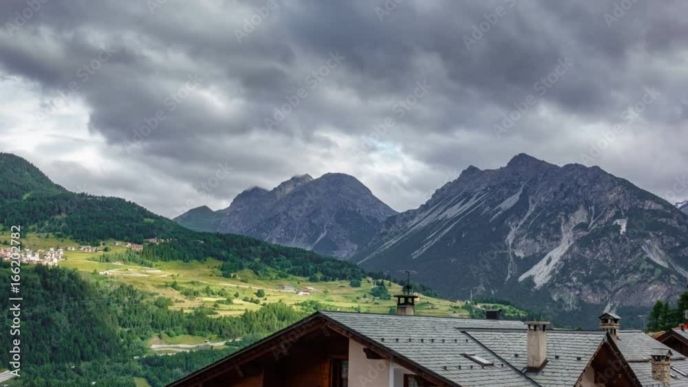 Fast clouds time lapse over mountain town