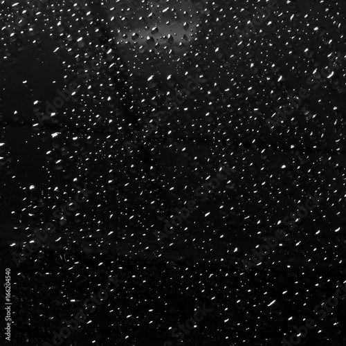 drops of rain on car window pane
