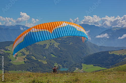 Paragliding above gorgeous mountain Garda Lake, start is from mount Monte Baldo, Italy
