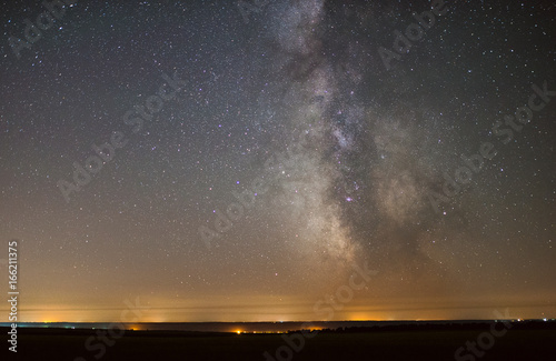 The center of our home galaxy, the Milky Way rising over the field, the night stars landscape