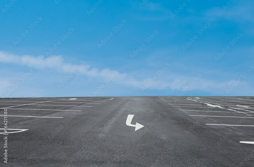 Fototapeta premium Empty parking place with blue sky background
