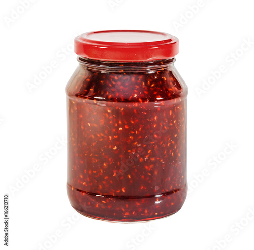 Raspberry jam in a glass jar, isolated on white