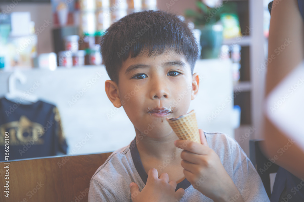Asian boy eating ice cream. Asian boy eating ice cream.