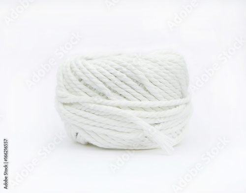 Roll of white yarn thread isolated on white background.