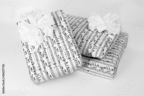 Three gift boxes with sheet music