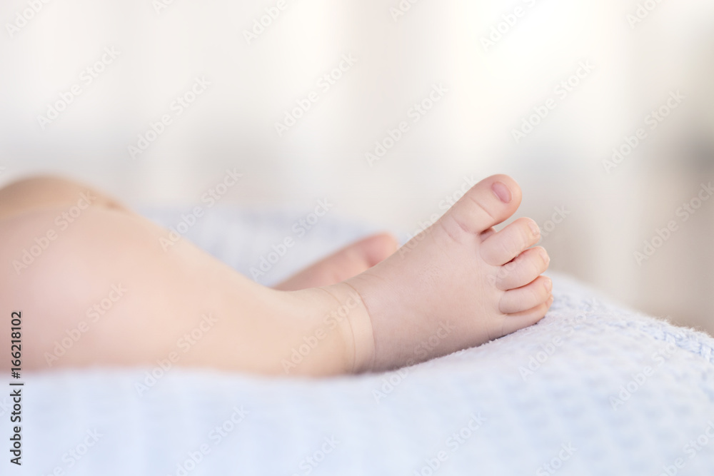 Cute Baby Boy Feet on A Blue Blanket
