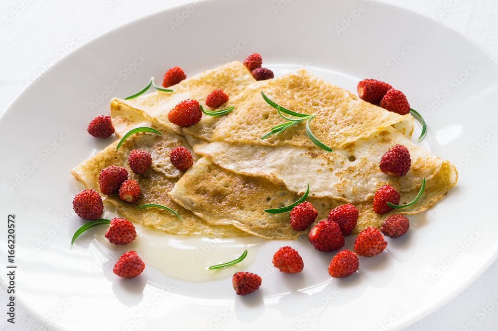 crepes with wild strawberry, honey, and rosemary crepes with wild strawberry, honey, and rosemary