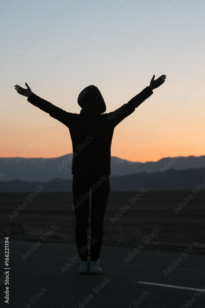 woman silhouette at sunset