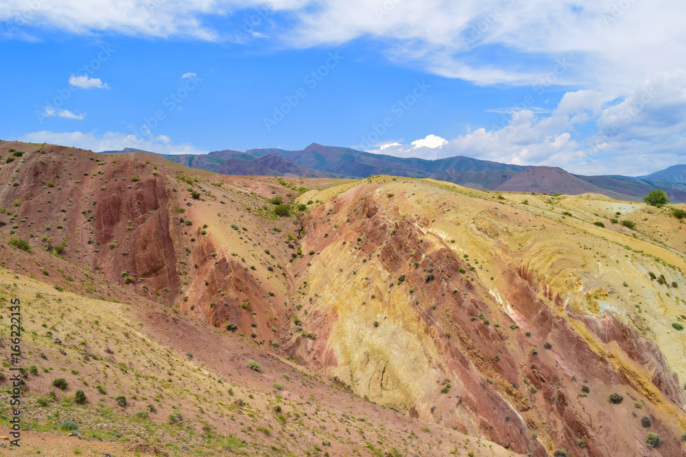 Martian landscape of Altai mountains. Colorful hill slopes. Altay Republic, Russia.