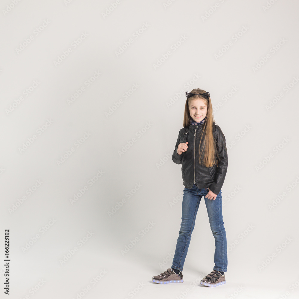 Fashionable teenage girl in a black jacket Fashionable teenage girl in a black jacket