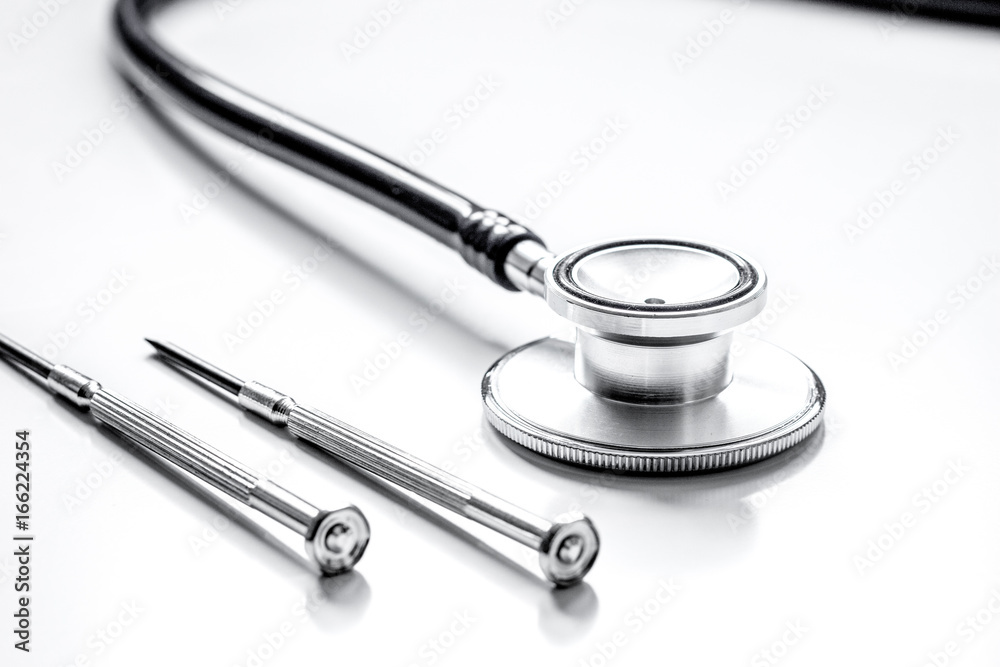 diagnostic of gadgets on white background with stethoscope