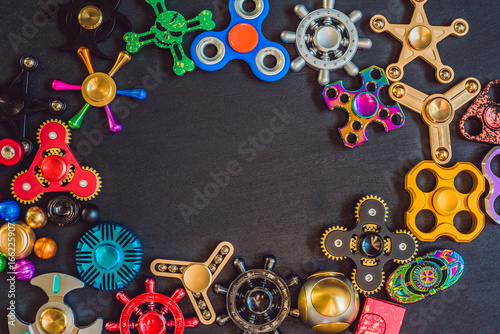 A lot of different spinners on a black background photo