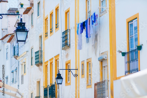 Lisbon beautiful house white facade with pretty yellow windows