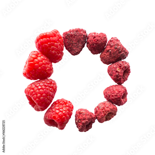 Obraz na plátně Freeze dried and fresh raspberry on a white background in the circle