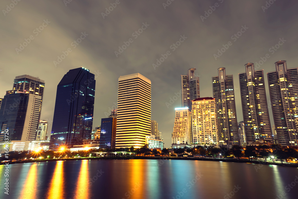 Bangkok thailand cityscape with water reflection at blue night sky