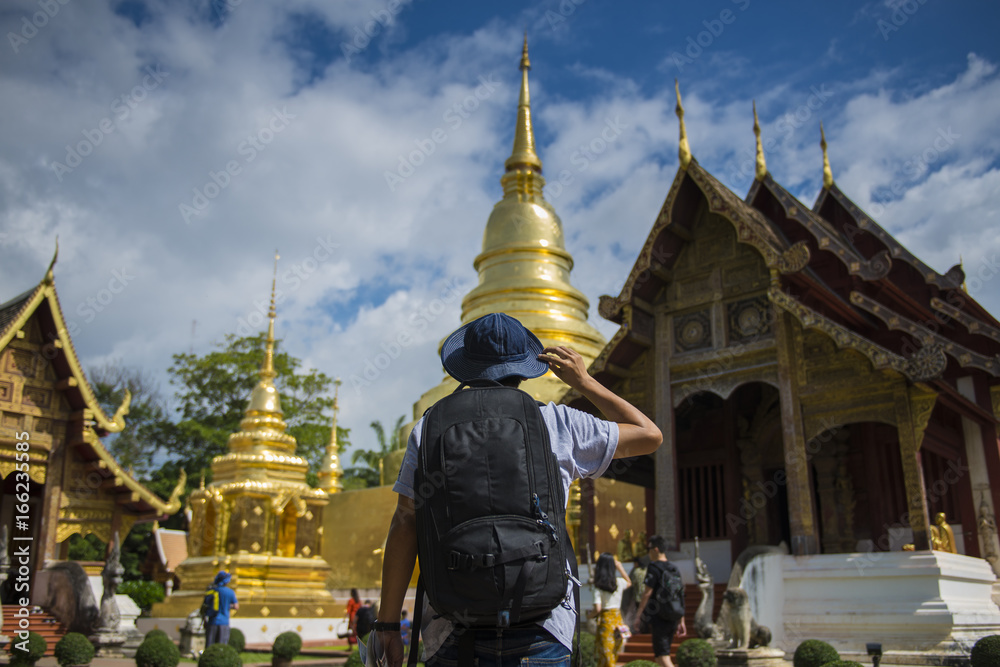 Fototapeta premium Man tourist is visiting at Wat Phra Singh in Chiangmai, Thailand.