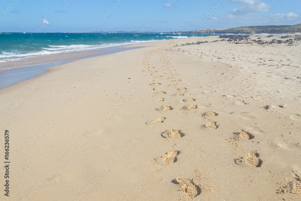Foot prints in Pessegueiro beach in Porto Covo Foot prints in Pessegueiro beach in Porto Covo