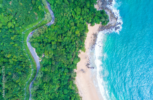 Fototapeta Naklejka Na Ścianę i Meble -  Sea aerial view,Top view,amazing nature background.The color of the water and beautifully bright.Azure beach with rocky mountains and clear water of Thailand ocean at sunny day.Winding road.