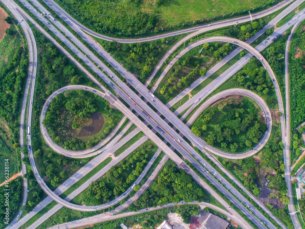 Aerial view, Road roundabout, Expressway with car lots in the city in Thailand. beautiful Street , downtown, cityscape, Top view. Background Aerial view, Road roundabout, Expressway with car lots in the city in Thailand. beautiful Street , downtown, cityscape, Top view. Background
