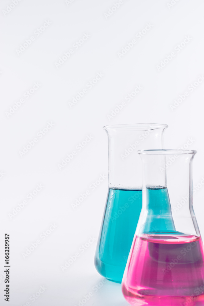 science and clinic background. Chemical and Medical laboratory research. laboratory beakers with colorful liquids and reagents. science and clinic background. Chemical and Medical laboratory research. laboratory beakers with colorful liquids and reagents.