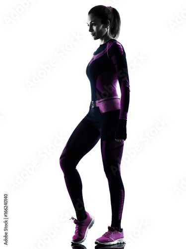 one young caucasian woman runner running jogger jogging isolated silhouette shadow on white background © snaptitude