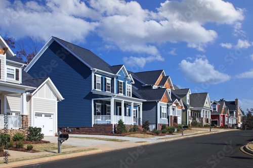 Generic, Colorful Houses on Suburban Neighborhood Street on a Sunny Day