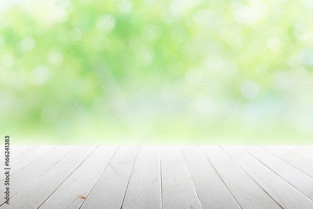 Empty wooden table with party in garden background blurred.