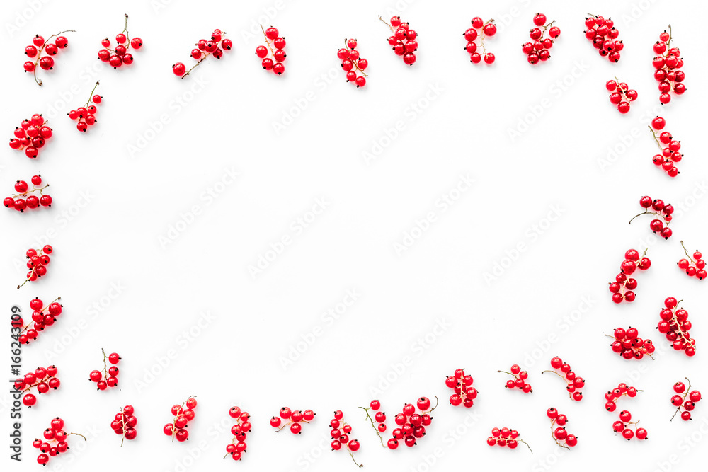 Berry frame. Red currant on white background top view copyspace