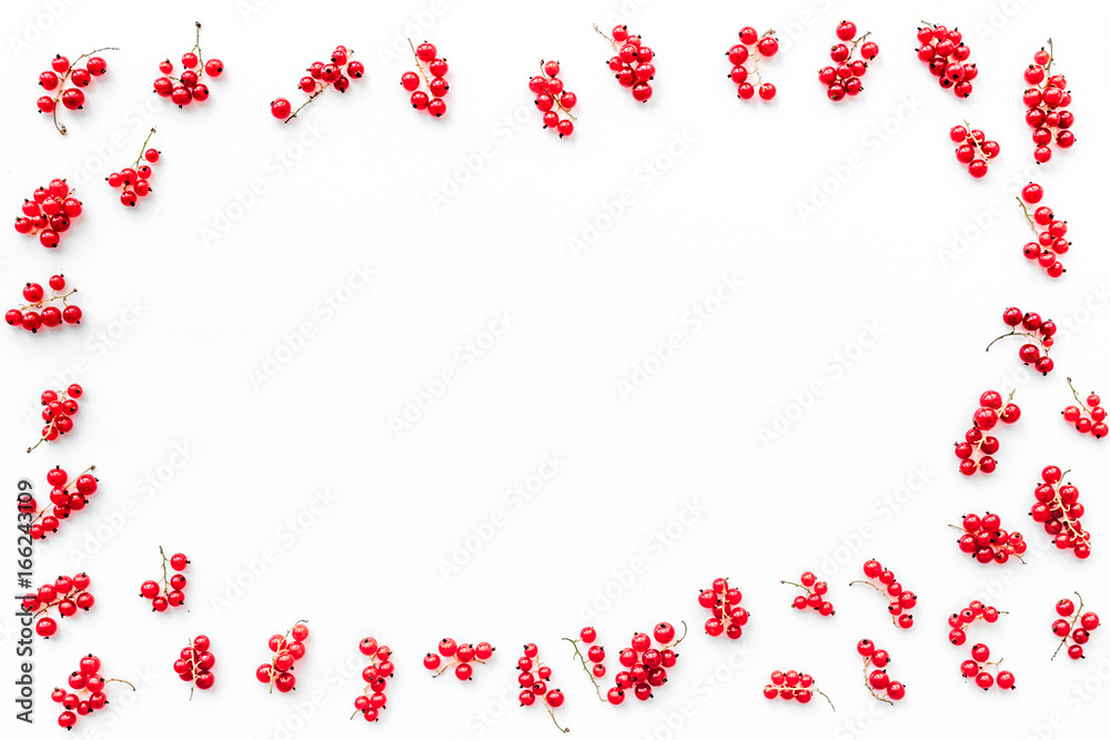 Berry frame. Red currant on white background top view copyspace Berry frame. Red currant on white background top view copyspace