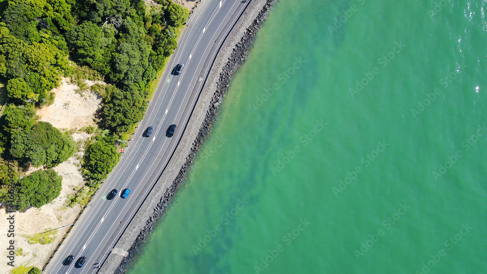 Aerial view on a road running along sea shore. Auckland, New Zealand.