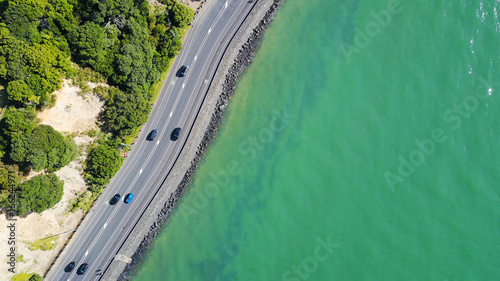Aerial view on a road running along sea shore. Auckland, New Zealand.