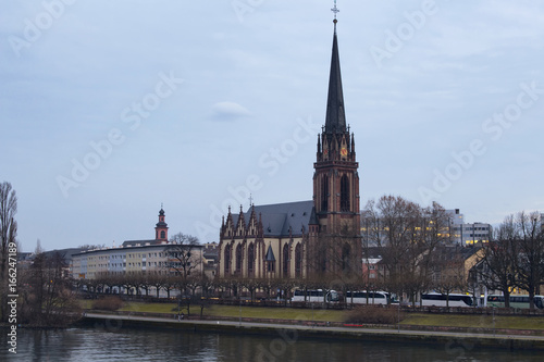 View of Dreikonigskirche Protestant Church by main river in Fran