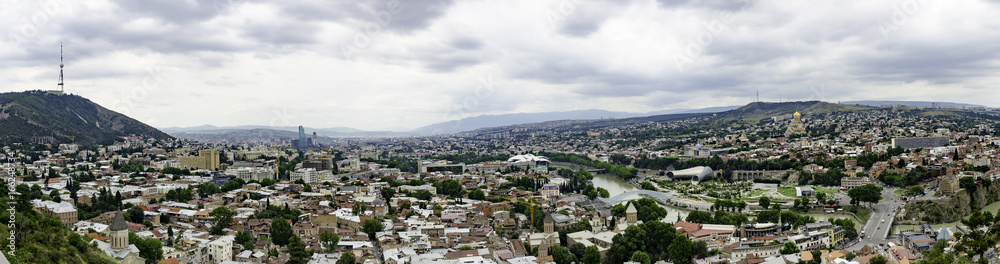 The Panoramic Top View Of Motley Historic Part Of Tbilisi, Georgia In Summer. Skyline And Beautiful Sunset Sunrise On Picturesque Sky Background Over Central Part Of The City With Famous Landmarks.