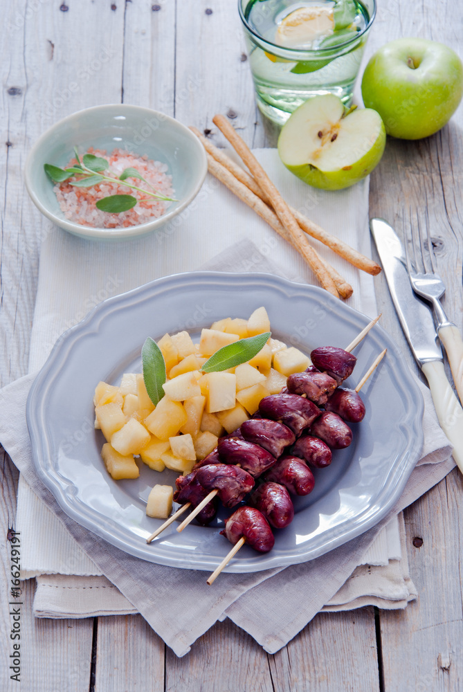 Grilled chicken hearts on skewers with stewed apples Grilled chicken hearts on skewers with stewed apples