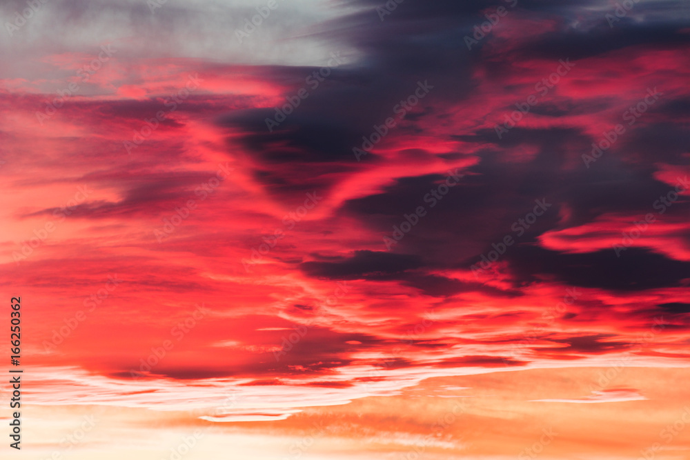 colorful fiery sky abstract at sunset with altocumulus clouds