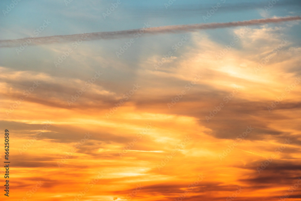 golden sky with cirrus and cirrostratus clouds at sunset - abstract at sundown