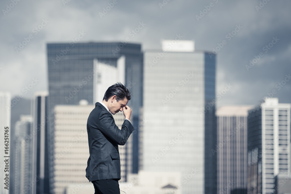 Stressed business man walking in the city. Getting fired concept.  