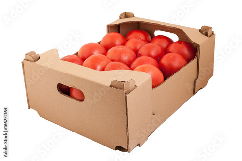 Fresh and tasty organic tomatoes in cardboard box, isolated on white