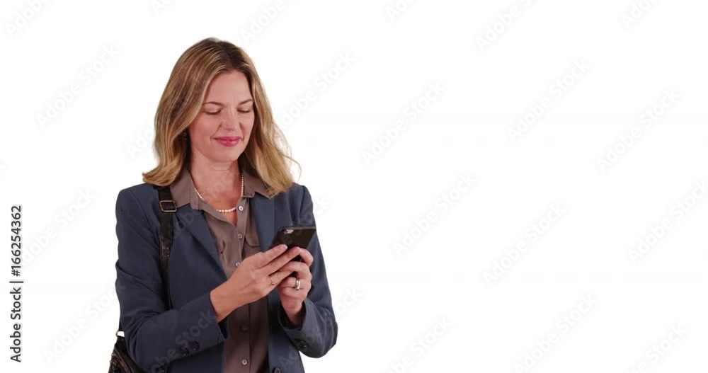 Smiling business woman on white background with copy space texting on smartphone Smiling business woman on white background with copy space texting on smartphone