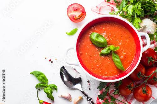 Tomato soup  on white. Top view copy space.