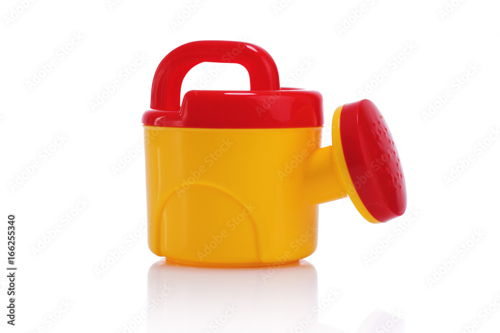 Child's plastic watering can isolated on white Child's plastic watering can isolated on white