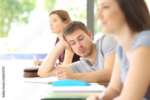 Photography Bored student distracted during a class at classroom