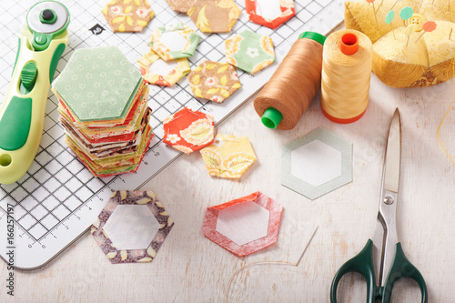 English paper pieced hexagons on white craft mat
