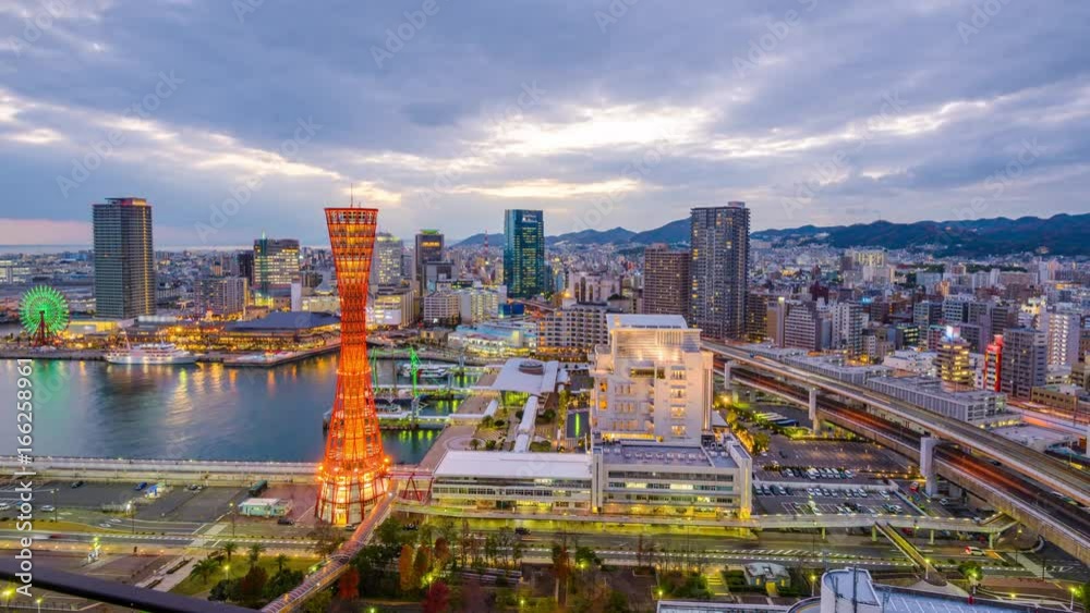 Kobe, Japan skyline at the port and tower from dusk to night.