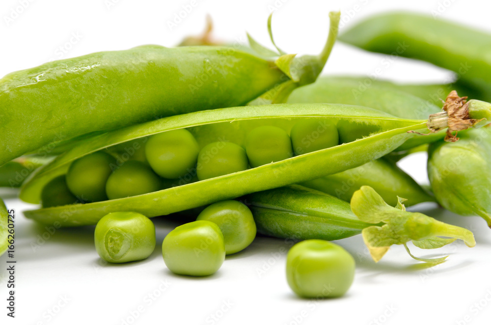 Pods of green peas isolated on a white background. Green, ripe, fresh vegetables. Legumes. Pods of green peas isolated on a white background. Green, ripe, fresh vegetables. Legumes.