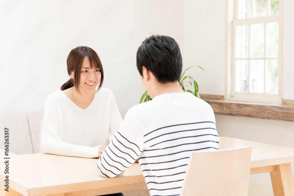 portrait of young asian couple relaxing in living room portrait of young asian couple relaxing in living room