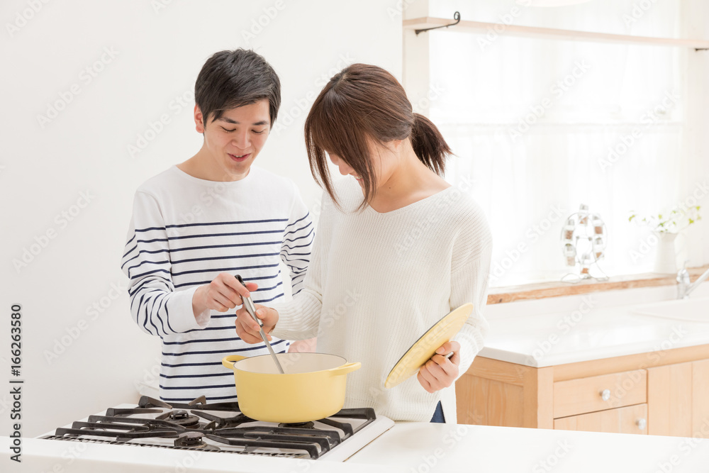 portrait of young asian couple in kitchen portrait of young asian couple in kitchen