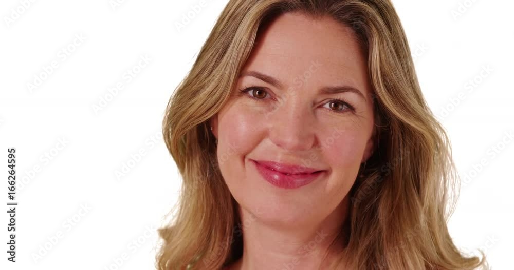 Close up of Caucasian woman smiling at camera on white background with copyspace Close up of Caucasian woman smiling at camera on white background with copyspace