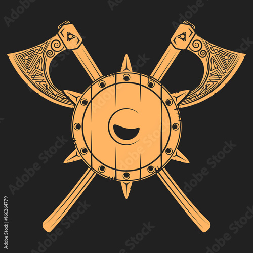 Damaged medieval shield with crossed axes. Vikings related t-shirt graphics and design elements. Vector vintage illustration.