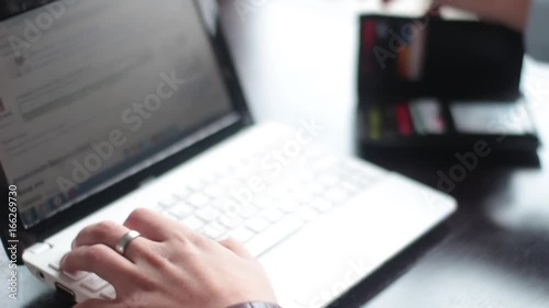 Wallpaper Mural Financial Strategy. Man working on the laptop and doing financial strategy in cafe. Torontodigital.ca